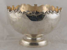 A silver punch bowl with