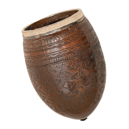 A silver rimmed coconut beaker,