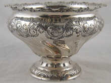 A silver rosebowl of swirl inverted