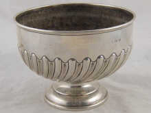 A silver rosebowl with swirl half