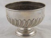 A silver rosebowl with swirl h