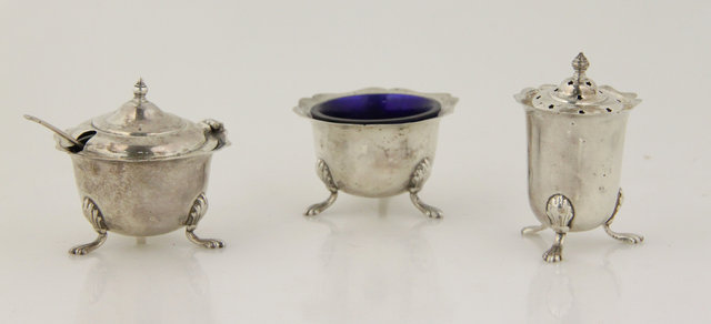 A silver salt pepper and mustard