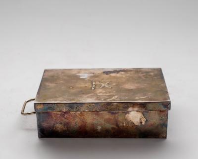 A silver sandwich tin, makers