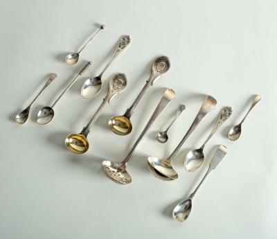 A silver sauce ladle, a sugar