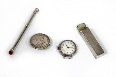 A silver scent bottle case with