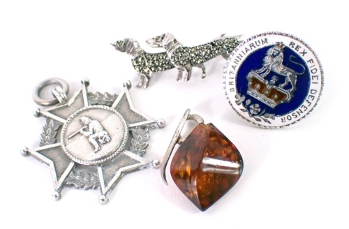 A silver shield fob, a dachshund