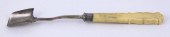 A silver stilton cheese scoop