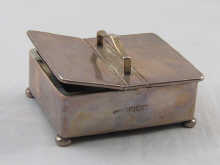 A silver table vesta in the form of