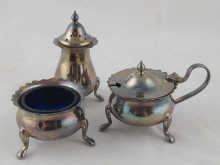 A silver three piece cruet set