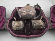 A silver three piece ''tete a
