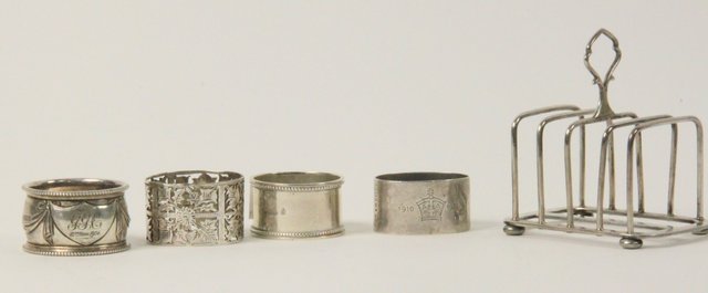 A silver toast rack H & H