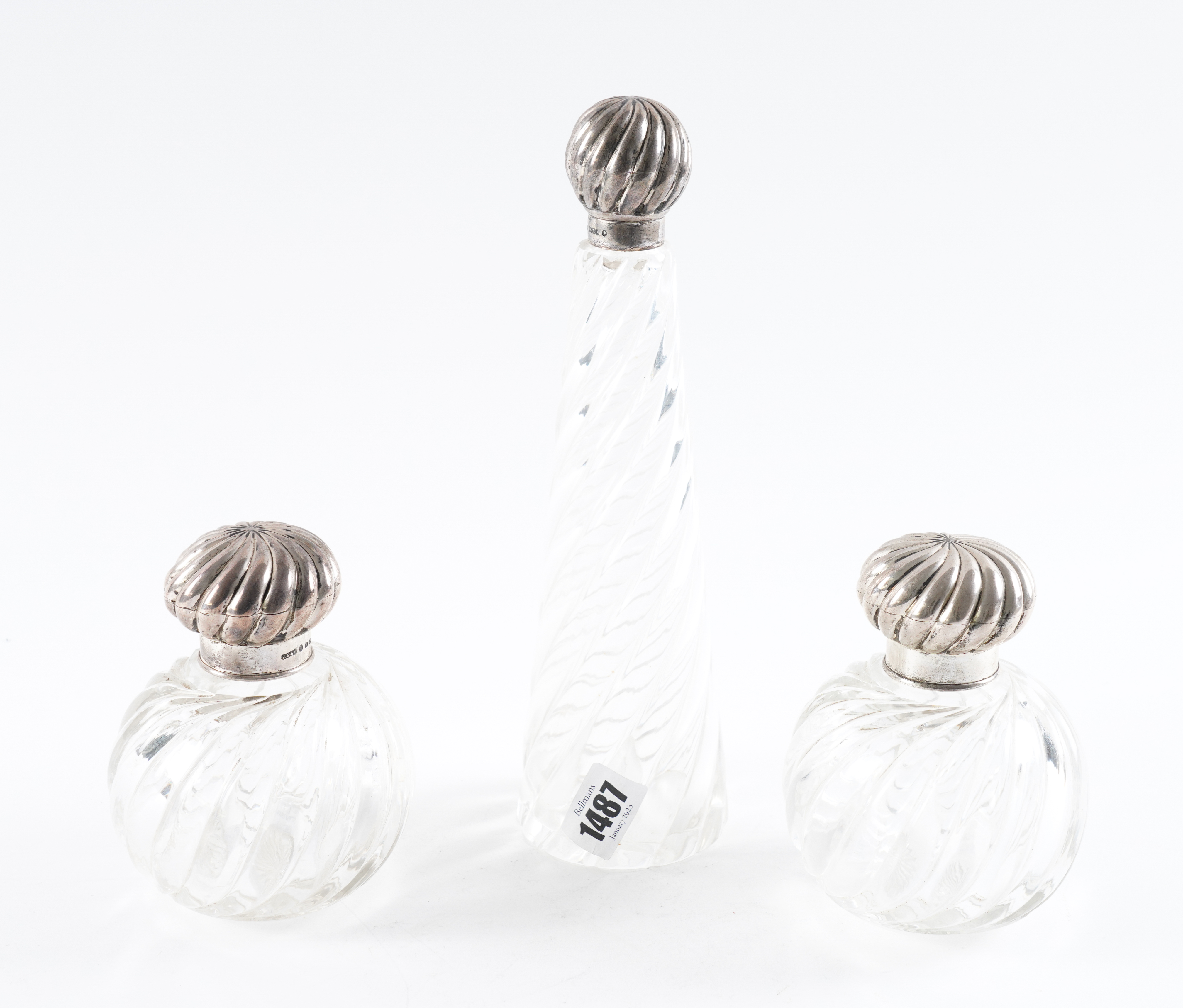 A SILVER TOPPED SCENT BOTTLE