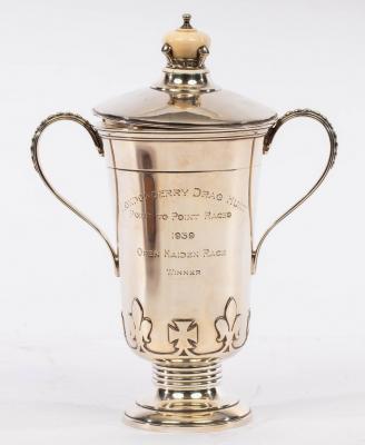 A silver trophy cup and cover,