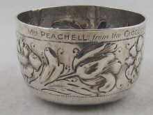 A silver tumbler cup with