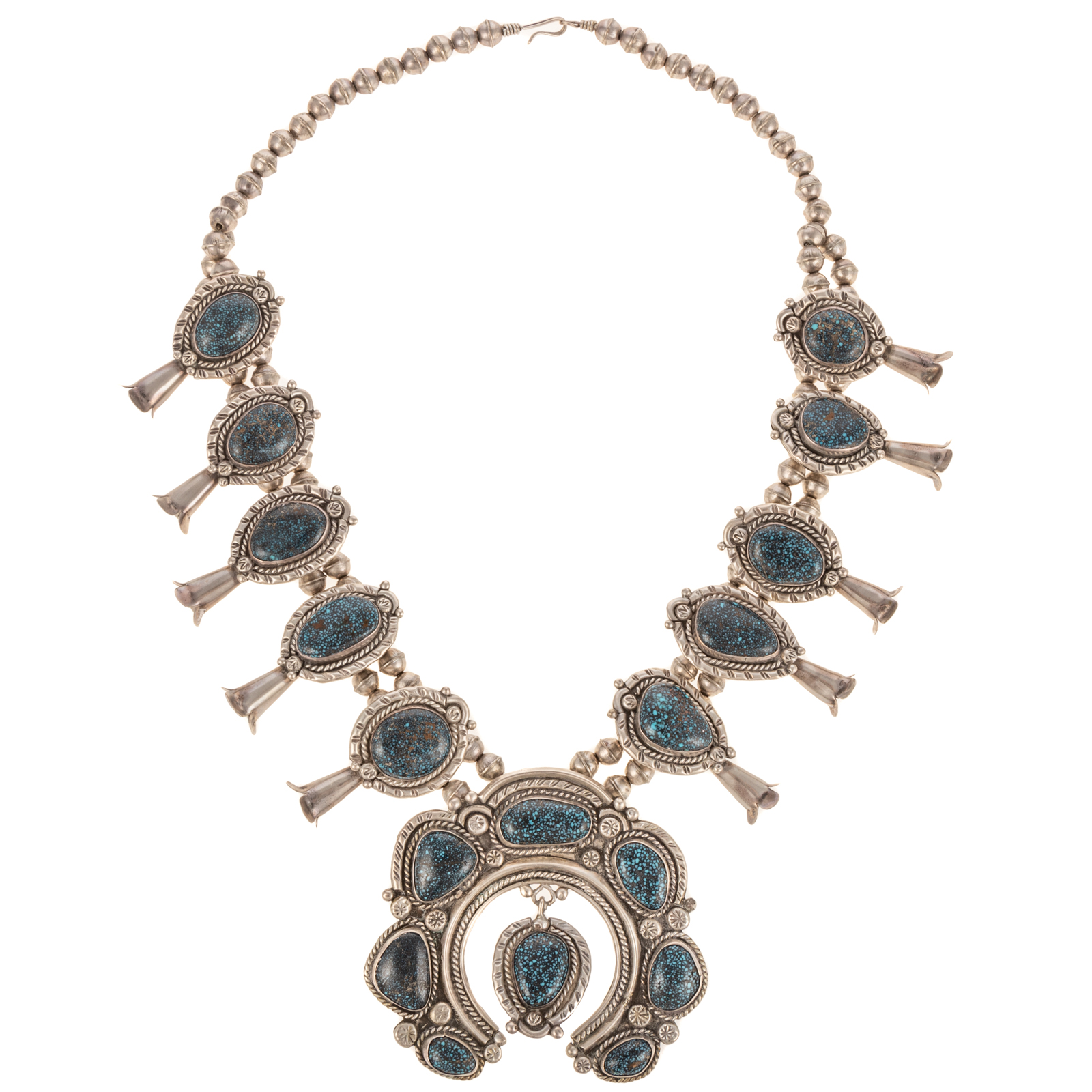 A SILVER & TURQUOISE SQUASH BLOSSOM