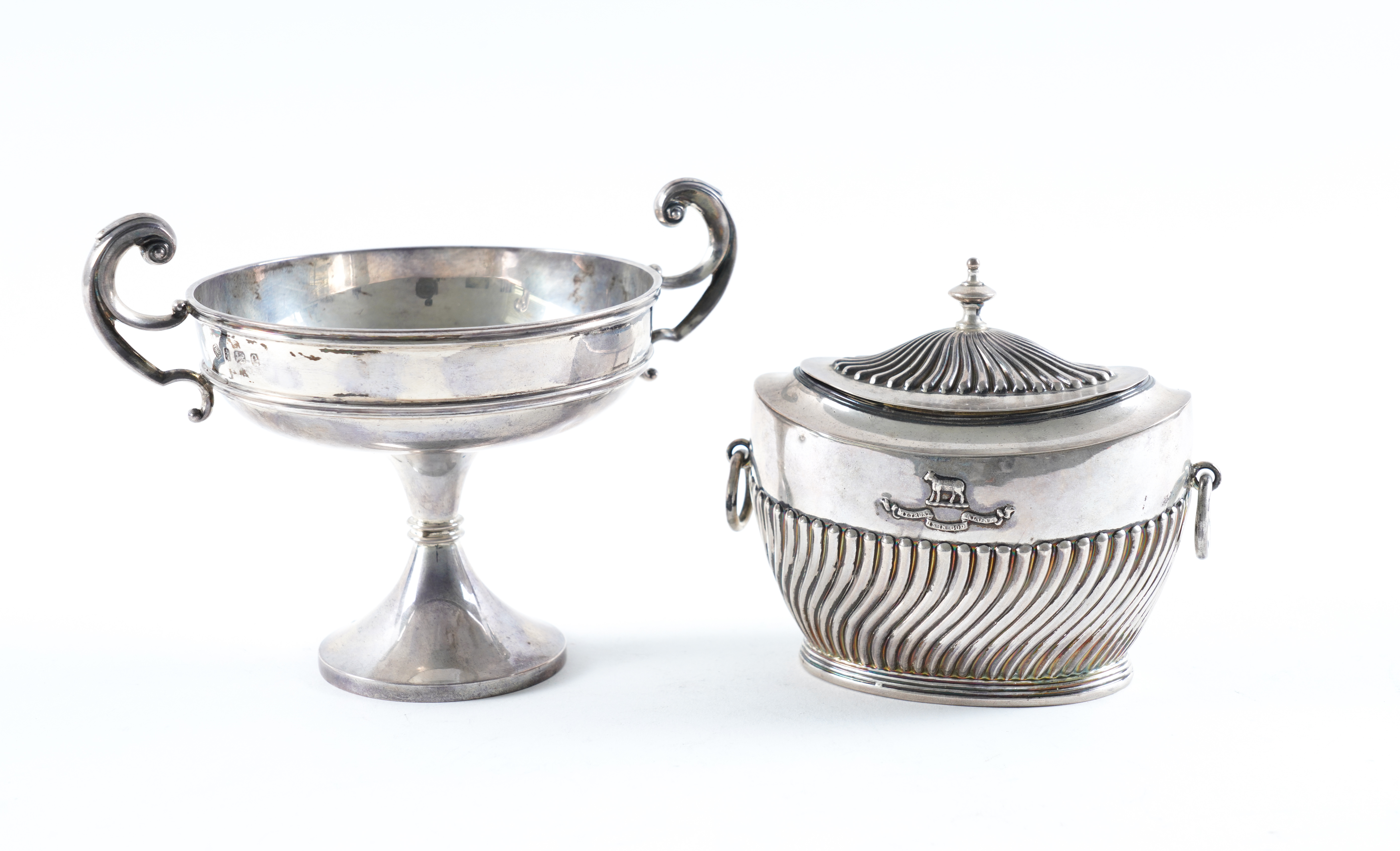 A SILVER TWIN HANDLED TEA CADDY AND