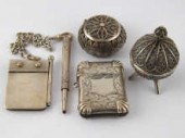 A silver vesta case with brigh