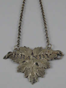 A silver Victorian brandy label