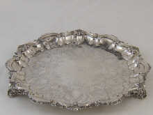 A silver waiter on three feet