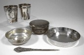 A silvery metal tumbler with r