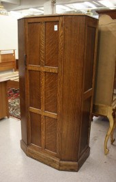 A SINGLE-DOOR OAK WARDROBE, EN