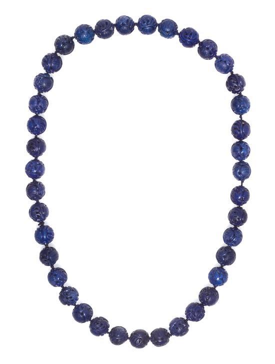 *A Single Strand Carved Lapis