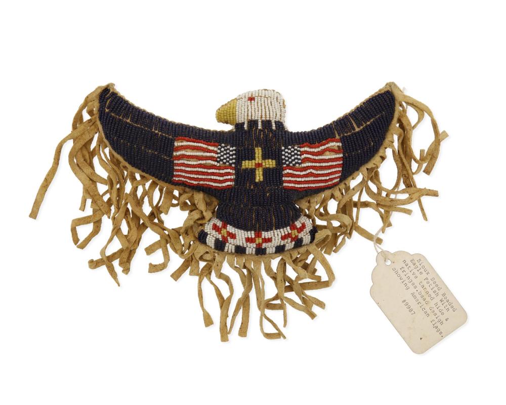 A SIOUX BEADED HIDE EAGLE ORNAMENTA