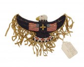 A SIOUX BEADED HIDE EAGLE ORNA