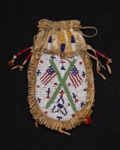 A SIOUX BEADED HIDE FLAG BAGA