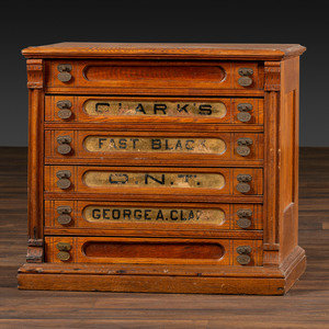 A Six-Drawer Oak Spool Cabinet