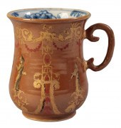 A SMALL BELL-SHAPED MUG (CAPUC