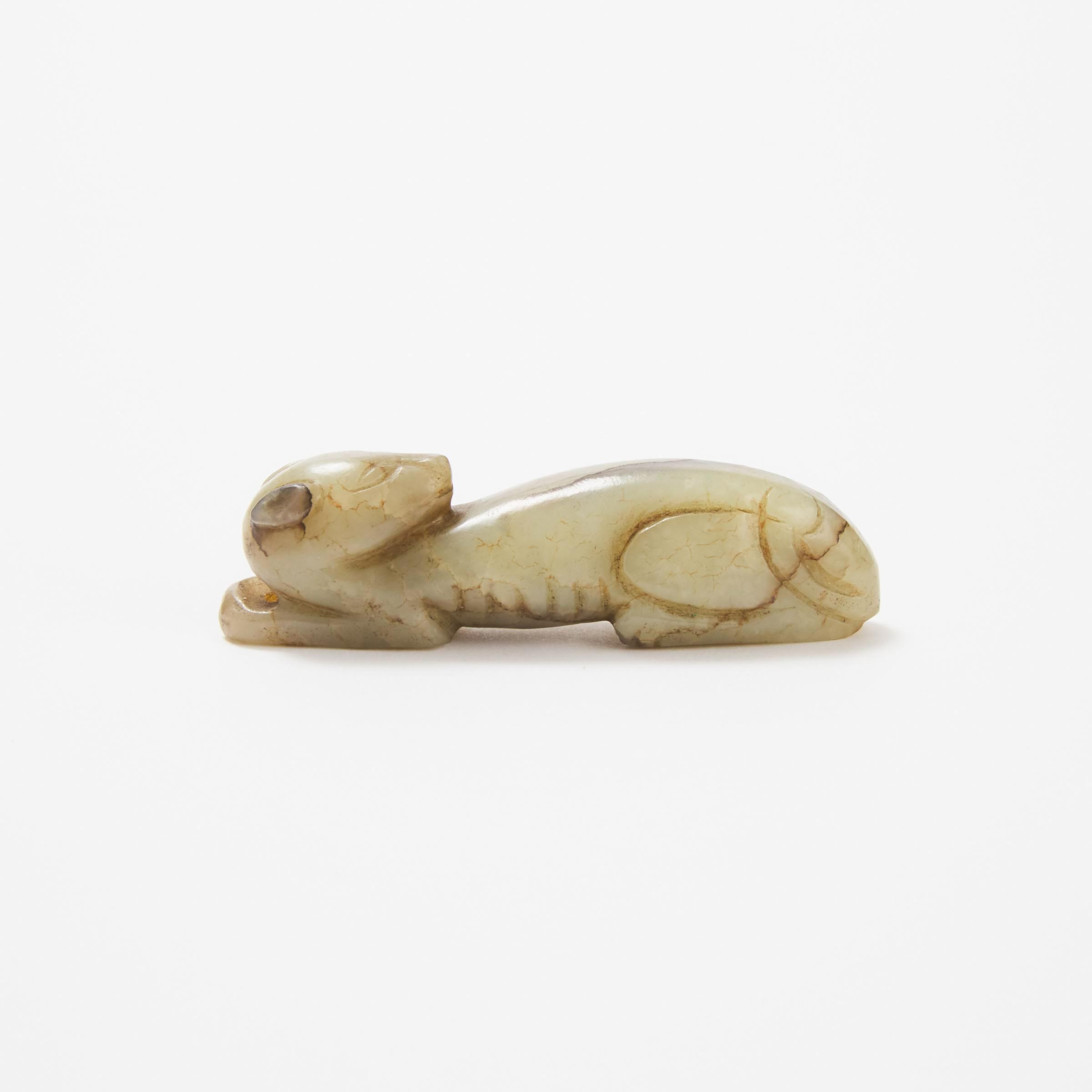 A Small Celadon and Russet Jade