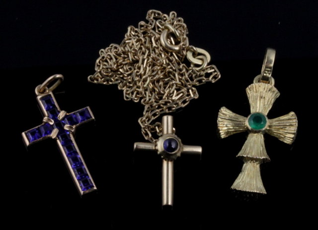 A small cross centered by a