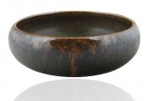 A SMALL GLAZED STONEWARE BOWL