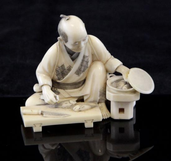 A small Japanese ivory okimono of a