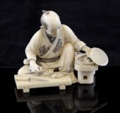 A small Japanese ivory okimono