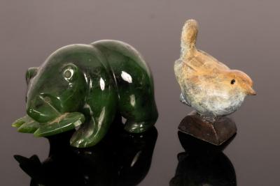 A small patinated bronze wren
