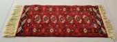 A SMALL RED BUKHARA RUGWith bl