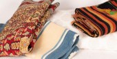A small rug, a blue and cream