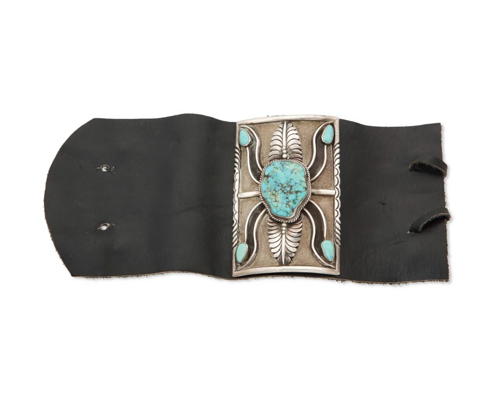 A SMALL SILVER AND TURQUOISE