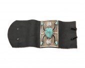 A SMALL SILVER AND TURQUOISE K