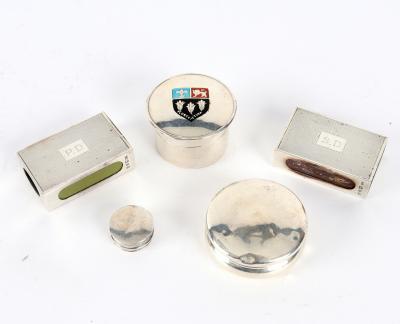 A small silver circular box and