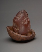 A SMALL STONE PAINT POT AND PE