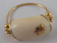 A small yellow metal (tests 18