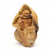 A SOAPSTONE CARVING OF BODHIDH