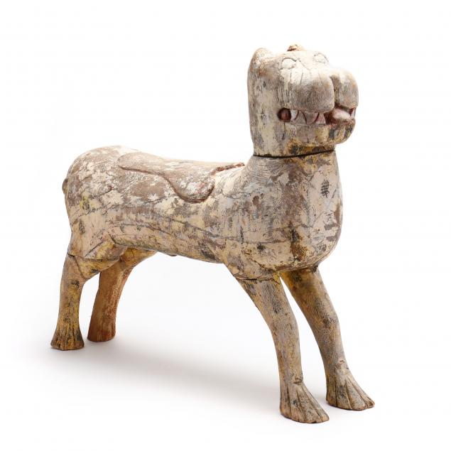 A SOUTHEAST ASIAN CARVED WOODEN