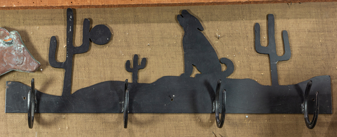 A SOUTHWESTERN SCENE METAL HAT RACK
