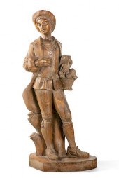 A SPANISH CARVED PINE FIGURE O