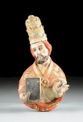 A SPANISH COLONIAL STYLE CARVE