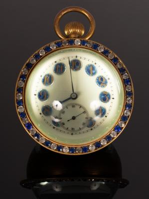 A spherical glass paperweight clock